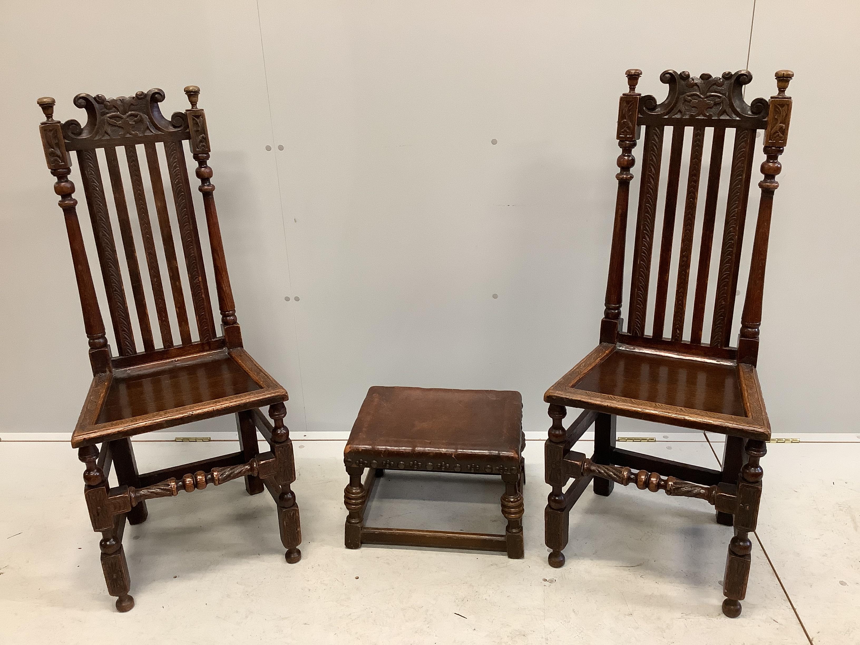 A pair of 17th century style carved oak chairs and a small stool